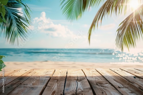 Sunny tropical beach landscape with palm trees and a wooden foreground