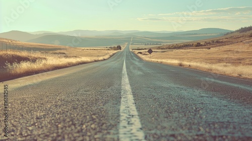 Desolate road stretching into the distance with vintage filter conveying solitude and quietness