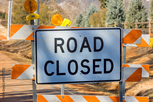 Quadro em tela There is orange striped road closure sign near an ongoing construction project t