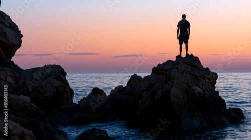 Silhouette of a man on some rocks on the coast of the Costa Brava in the province of Gerona in Spain during sunset   Generative AI