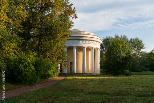 View of the Temple of Friendship on the bank of the Slavyanka River in the Pavlovsky Park on a sunny summer day, Pavlovsk, Saint Petersburg, Russia photo