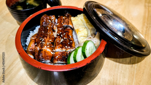 Unagi don, JapanBroiled eel served on box of riceese eel grilled with rice Japanese food. photo