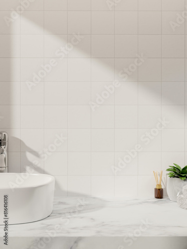 A luxurious white marble bathroom vanity countertop against the white tile wall with daylight shadow © bongkarn
