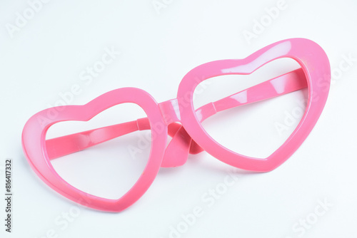 pink heart shape of glasses on white background