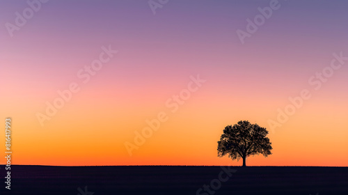 A lone tree stands out in stark silhouette against a gradient twilight sky with hues of orange and purple   Generative AI