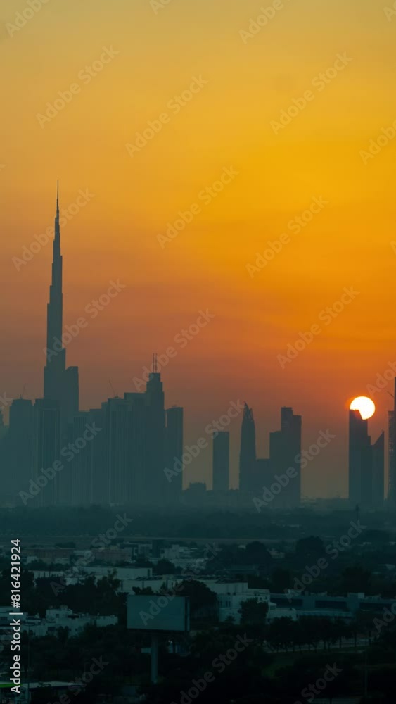 Vertical 4k Timelapse, Sunset Over Dubai Cityscape Skyline UAE. Silhouettes of Downtown Buildings Vertical 4k Timelapse, Sunset Over Dubai Cityscape Skyline UAE. Silhouettes of Downtown Buildings