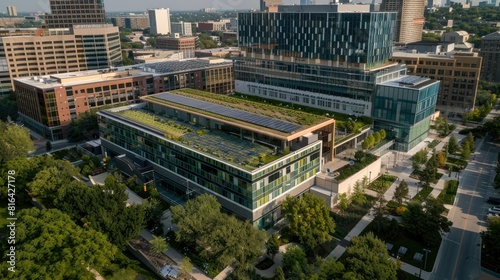 Aerial drone view of a hospital campus showcasing sustainable practices such as green roofs and solar panels for energy efficiency © Tusbol