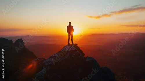 man standing on rock looking straight Nature and beauty concept Orange sundown silhouette at sunset : Generative AI