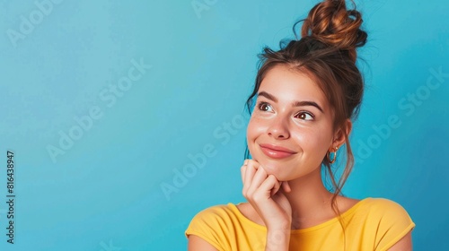 Portrait of attractive cheery girl making decision copy blank space place solution isolated over bright blue color