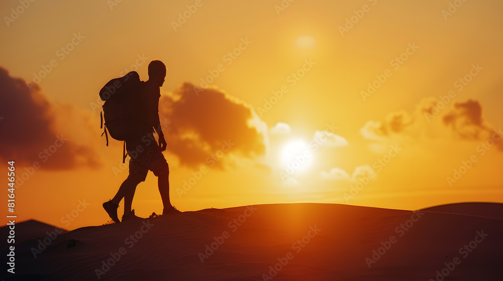 silhouette of a man with a backpack standing on a dune at sunset : Generative AI