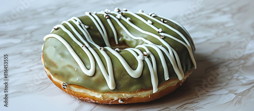 A donut with matcha glaze and white chocolate drizzle, photographed with a modern aesthetic for National Donut Day. 32k, full ultra HD, high resolution.