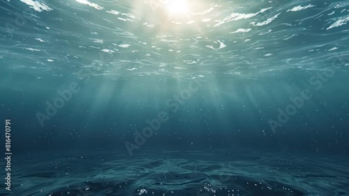 Underwater view of the sea surface with sunlight rays.