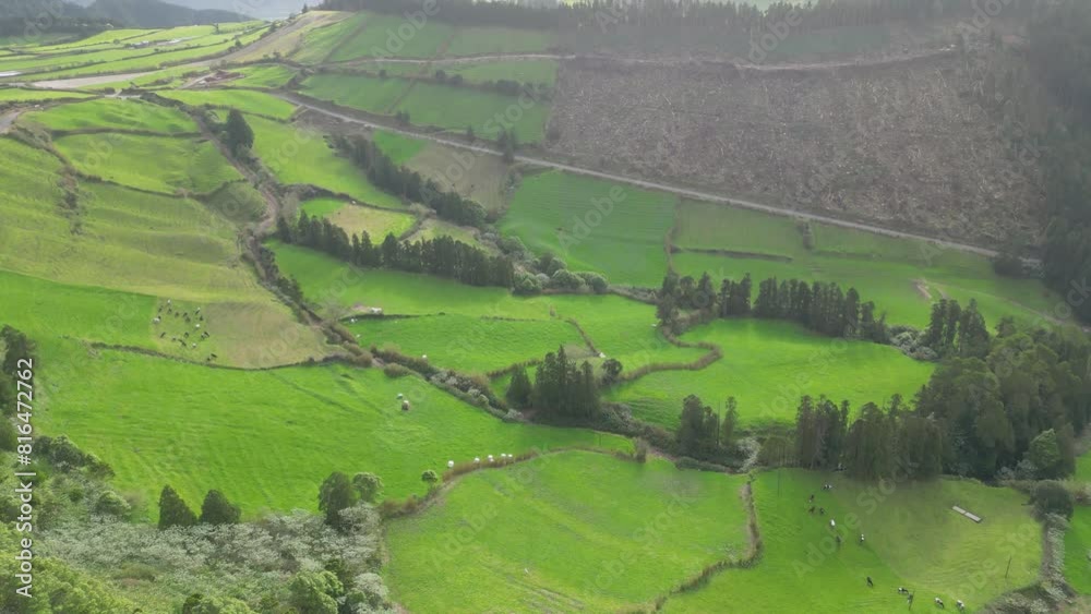 Cinematic hyperlapse blue lakes on green peaks, tropical island nature. Aerial hyper lapse twin lake Lagoa das Sete Cidades in the volcano crater. Ponta Delgada on Sao Miguel Island, Azores, Portugal