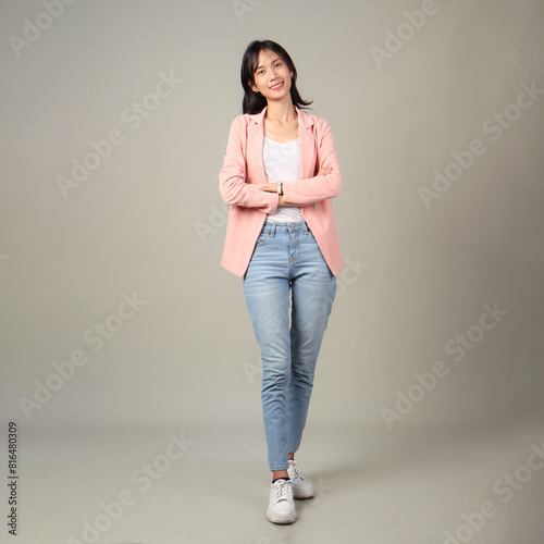 full lenght shoot of happy asian woman wearing formal casual outfit on isolated background