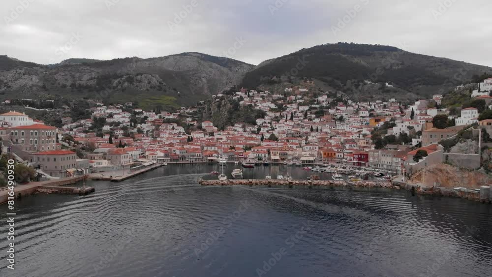 Marina And Port On Coast Of Hydra Island In Greece. aerial pullback shot