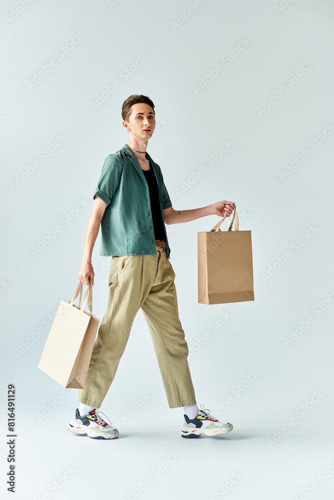 A young man exudes confidence while walking with shopping bags in hand, showcasing his trendy style. A young man exudes confidence while walking with shopping bags in hand, showcasing his trendy style.