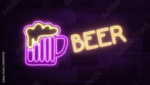 A neon sign showing a big pink purple mug, with with gilded froth and a big text inscription: Beer. Flickering against a brick wall. photo