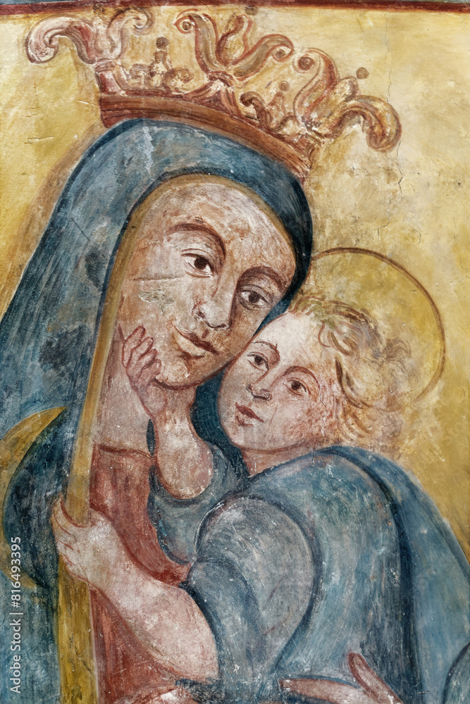 A mural fresco of Madonna with the child. Fresque murale de la Vierge Marie et l'enfant Jésus. Italie
