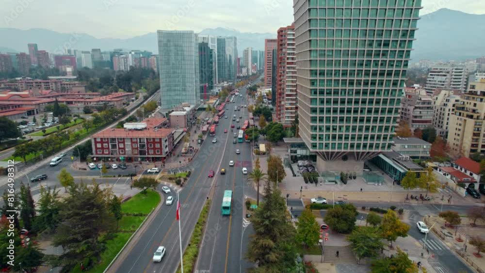 Aerial Drone Fast tracks traffic at Santiago de chile vibrant capital SCL building Apoquindo avenue at Escuela Militar neighborhood