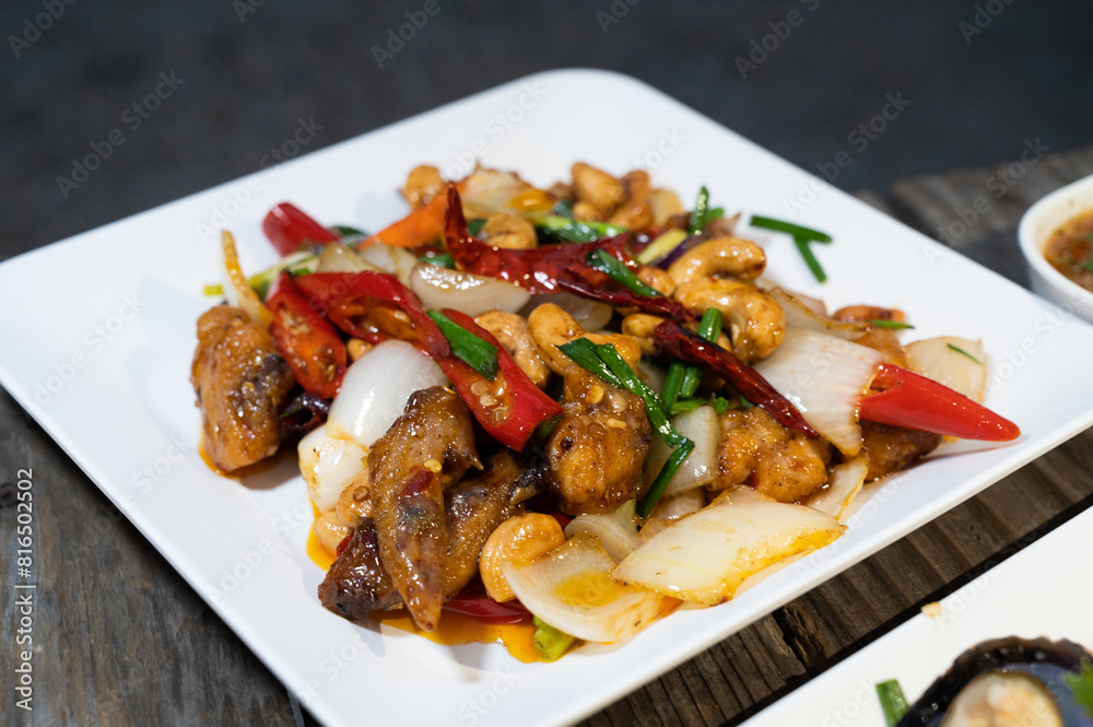 Thai food: Delicious fried pork and chicken served with rice and fresh vegetables. Thai food: Delicious fried pork and chicken served with rice and fresh vegetables.
