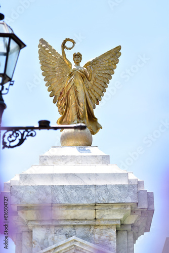 SAMUTPRAKAN, THAILAND - May 16, 2024: Statue of The Golden Angel Independence Monument at Assumption University, Suvarnabhumi Campus, Thailand. photo