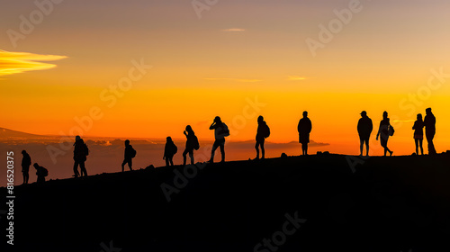 Silhouettes of people at sunset at the top of Haleakala volcano : Generative AI