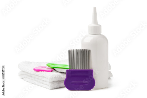 Comb, anti lice medicine and towel on white background