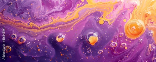 Purple and yellow soap bubbles in paint create an abstract design suitable for a colorful background. photo