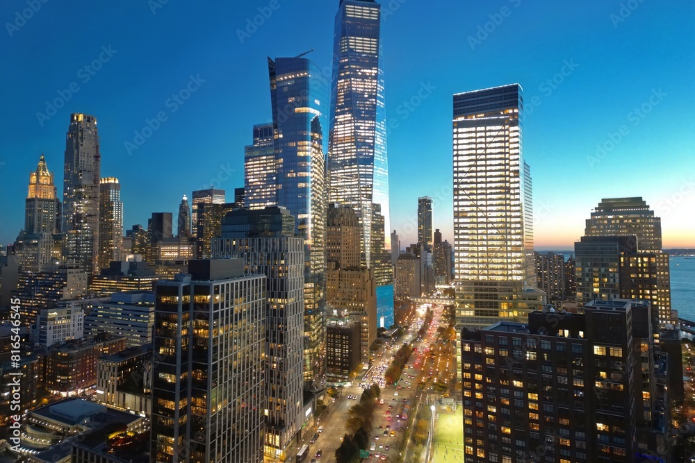 Fototapeta premium New York City famous view from drone. Night New York City from above. Night New York panorama, NYC skyline at twilight. Manhattan buildings skyscraper. New York famous building. Night traffic in NY.