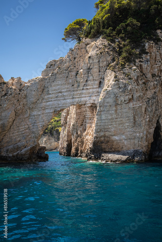 Vertical Stony Arch with Turquoise Ionian Sea in Greece. European Summer Landscape of Keri Caves in Zakynthos.