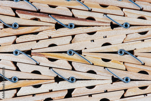 Wooden clothespin as background, accessories for home