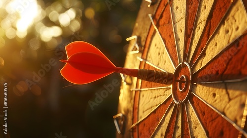 bullseye target or dart board has red dart arrow throw hitting the center of a shooting for business targeting and winning goals business concepts.