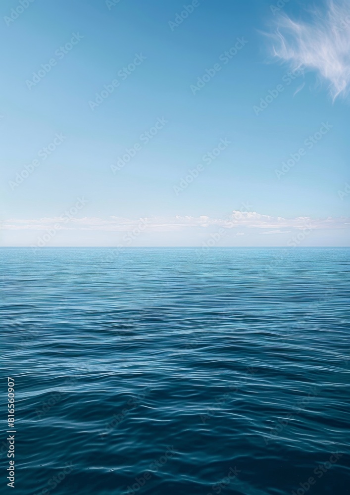 Obraz premium A serene ocean horizon with the sky blending into calm waters