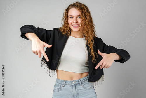 Woman in Crop Top and Jeans Pointing Down