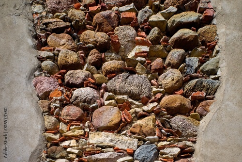 Fragment of a cobblestone wall. Background. Texture.