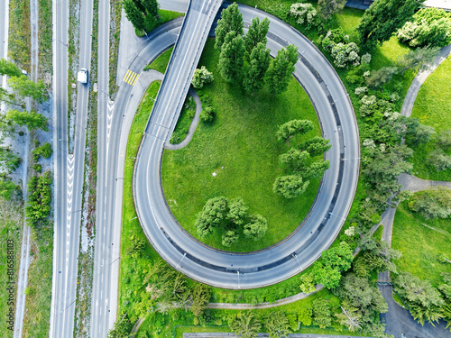 Topf view of Europe Bridge with spiral junction ramp, traffic and trees at Swiss City of Zürich on a sunny spring day. Photo taken May 14th, 2024, Zurich, Switzerland.