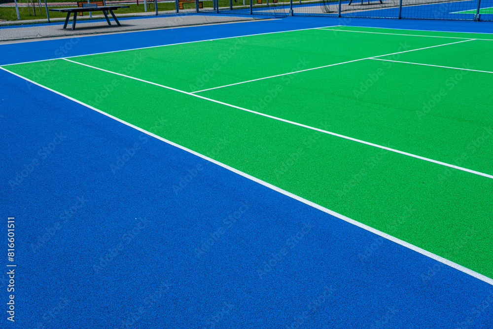 Fototapeta premium Part of the synthetic grass tennis court with markup