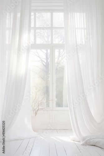 Soft light through white curtains in room