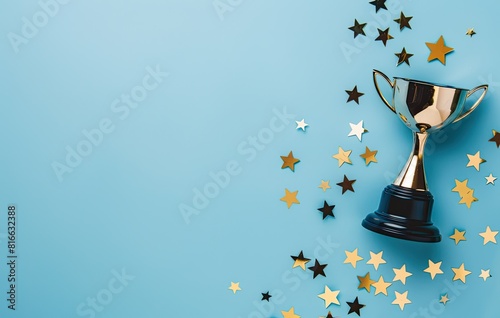 A golden trophy on a teal background, surrounded by sparkling stars. Symbolizes achievement, victory, and excellence. A perfect image for celebrating success, honoring winners, or motivating performe photo