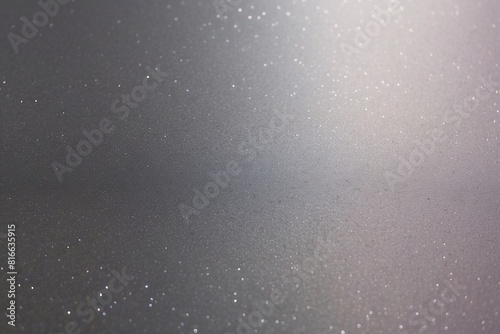 A soft-focus image of sparkling particles strewn across a subtly lit surface  emanating a magical glow