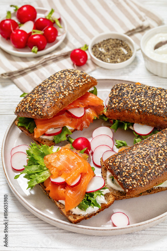 smoked salmon sandwiches on rye bread rolls