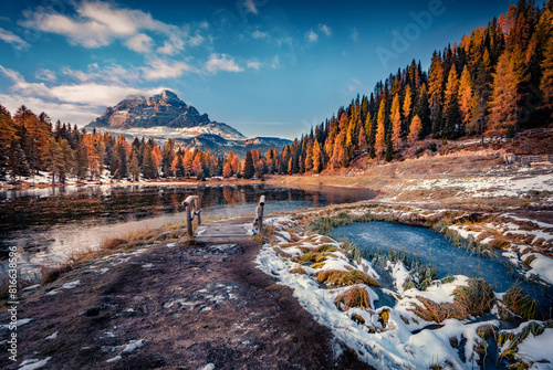 Dramatic autumn view of Antorno lake with Tre Cime di Lavaredo (Drei Zinnen) mount. Cold morning scene of Dolomite Alps, Province of Belluno, Italy, Europe. Beauty of nature concept background. © Andrew Mayovskyy