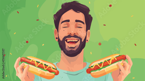 Portrait of happy young man with tasty hot dogs on green background 