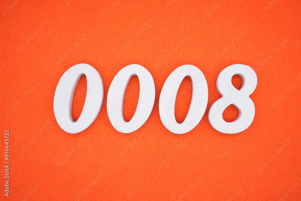 The number 0008 is made from white painted wood placed on a background of orange paper. The number 0008 is made from white painted wood placed on a background of orange paper.