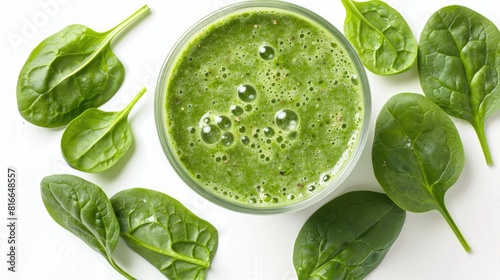 Healthy Green Spinach Smoothie Fresh spinach leaves in green juice on a white background
