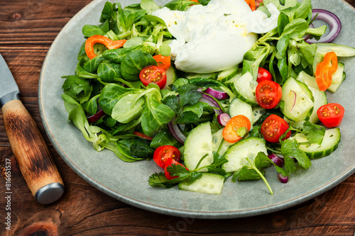 Light salad with Burrata cheese and vegetables
