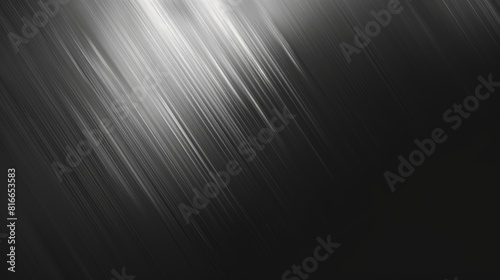 The image is a black and white abstract background with a shiny silver surface. It is suitable for use as a background for text or images. photo