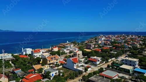 St. Paraskevi Church And The Aegean Sea In Artemida, Greece. - aerial shot photo