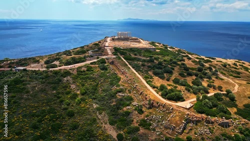 Temple of Poseidon Ruins At Cape Sounion With Myrtoan Sea In Greece. - aerial shot photo