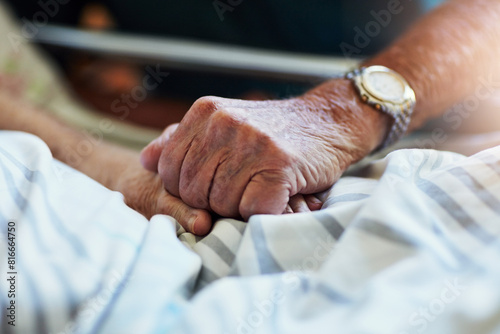 Senior person, holding hands and visit with hospital, closeup and elderly care or love together. Elderly people, couple and relationship with medical checkup, help and empathy for surgery recovery